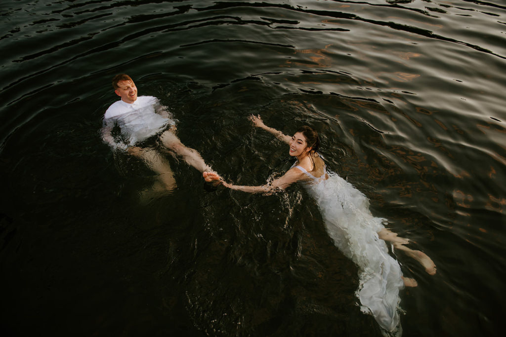 Couple swimming in the ocean on the Sunshine Coast during their BC elopement package.