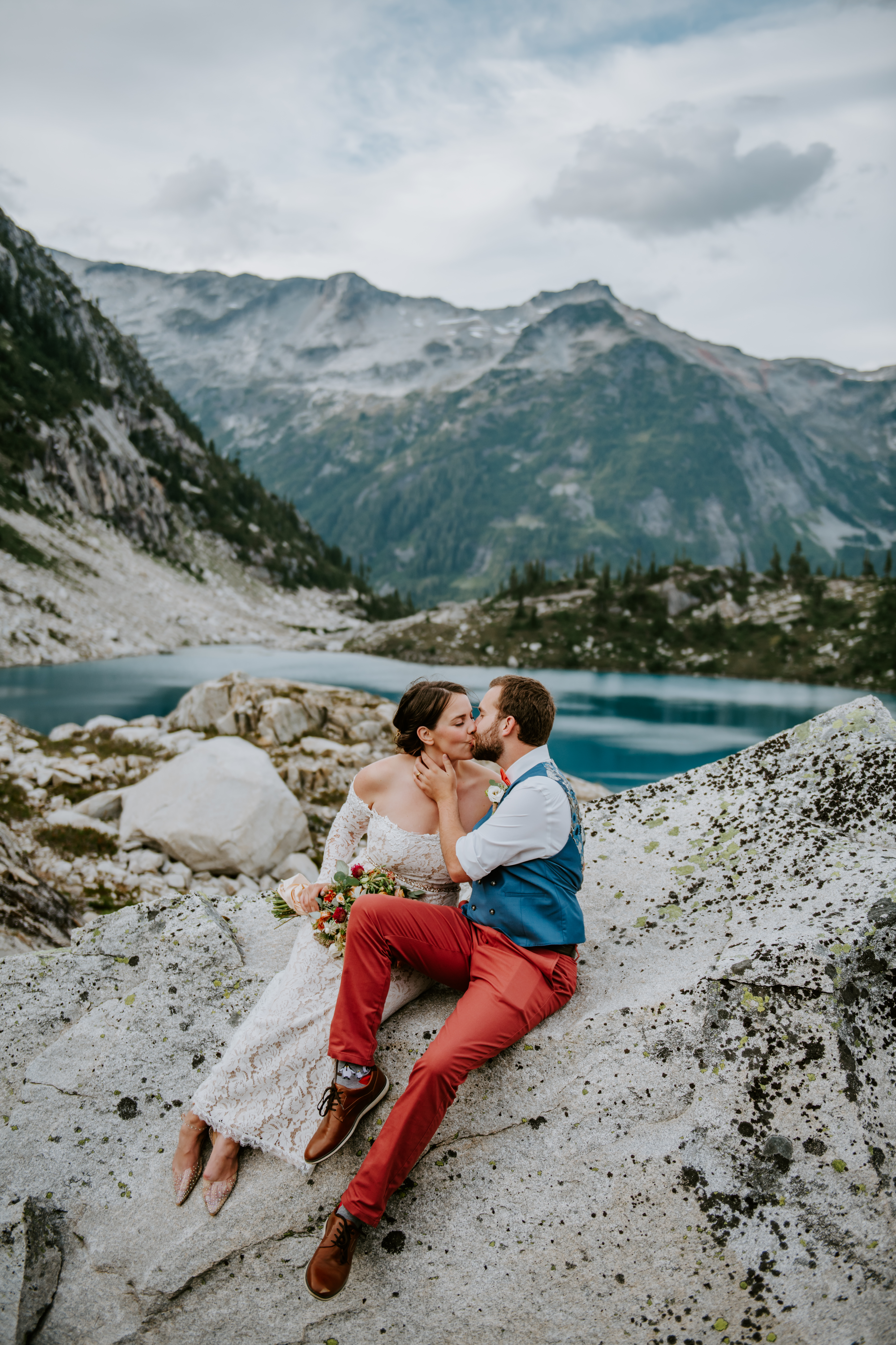 Couple kissing during their alpine lake elopement during their BC elopement package