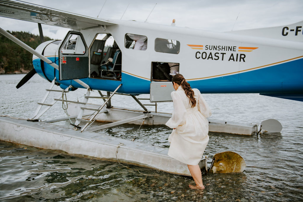 Bride boarding Sunshine Coast Air float plane from Thormanby Island during her British Columbia Adventure Elopement.